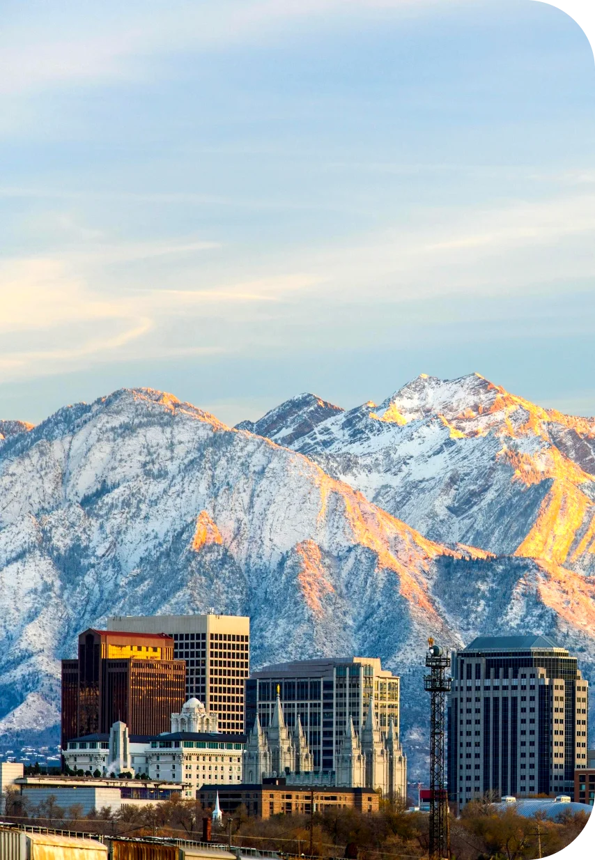 View of Salt Lake with buildings and mountains.
