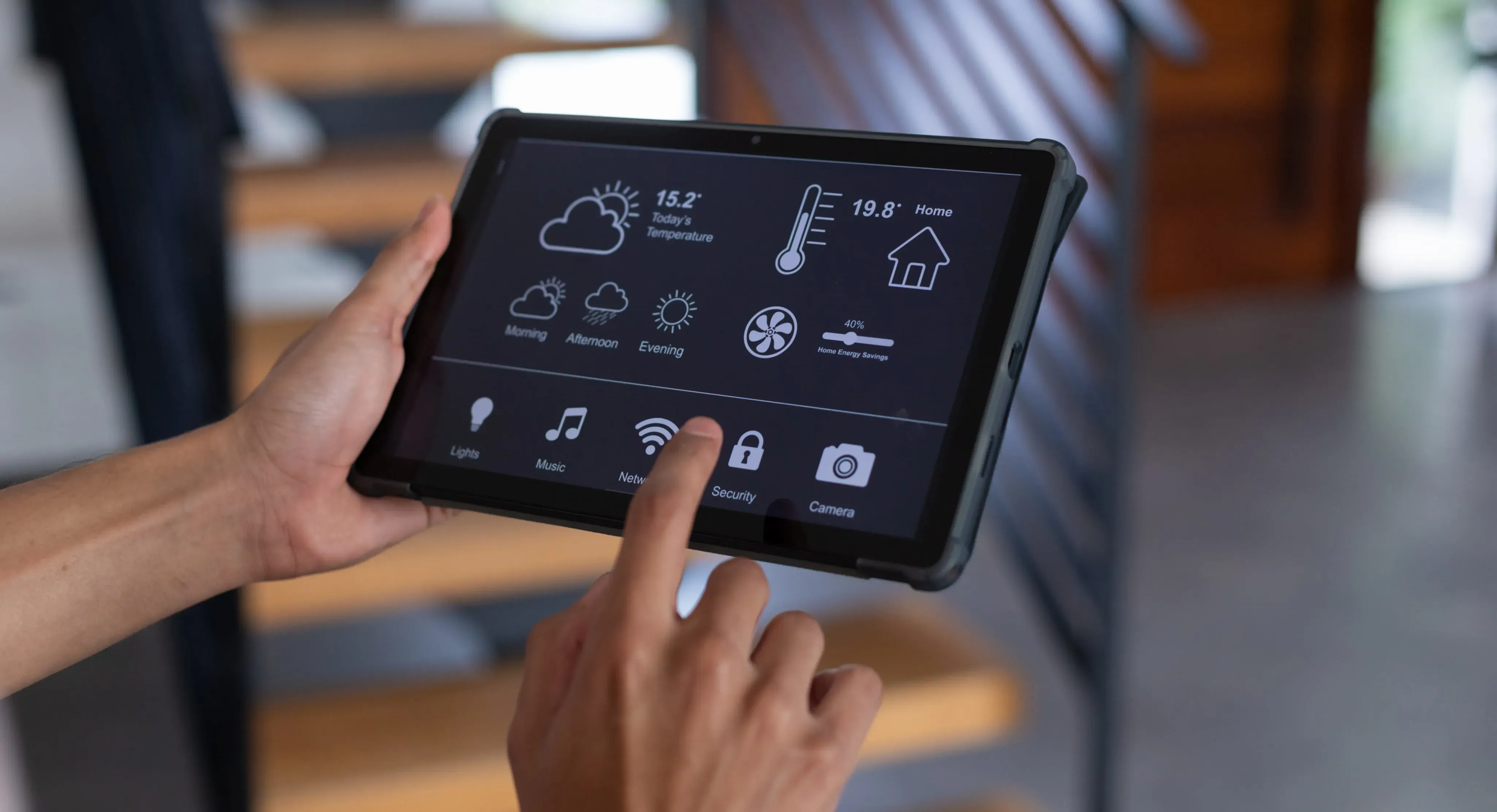 A person touching a tablet.